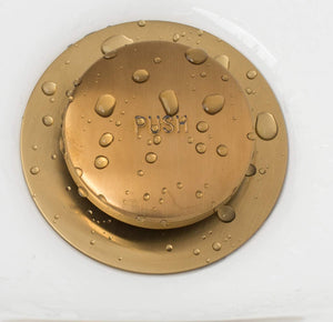 
                  
                    Brushed gold tub drain with two holes
                  
                